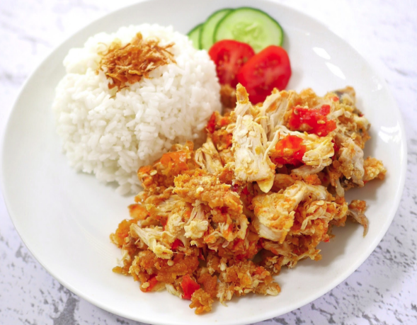 a plate of ayam geprek